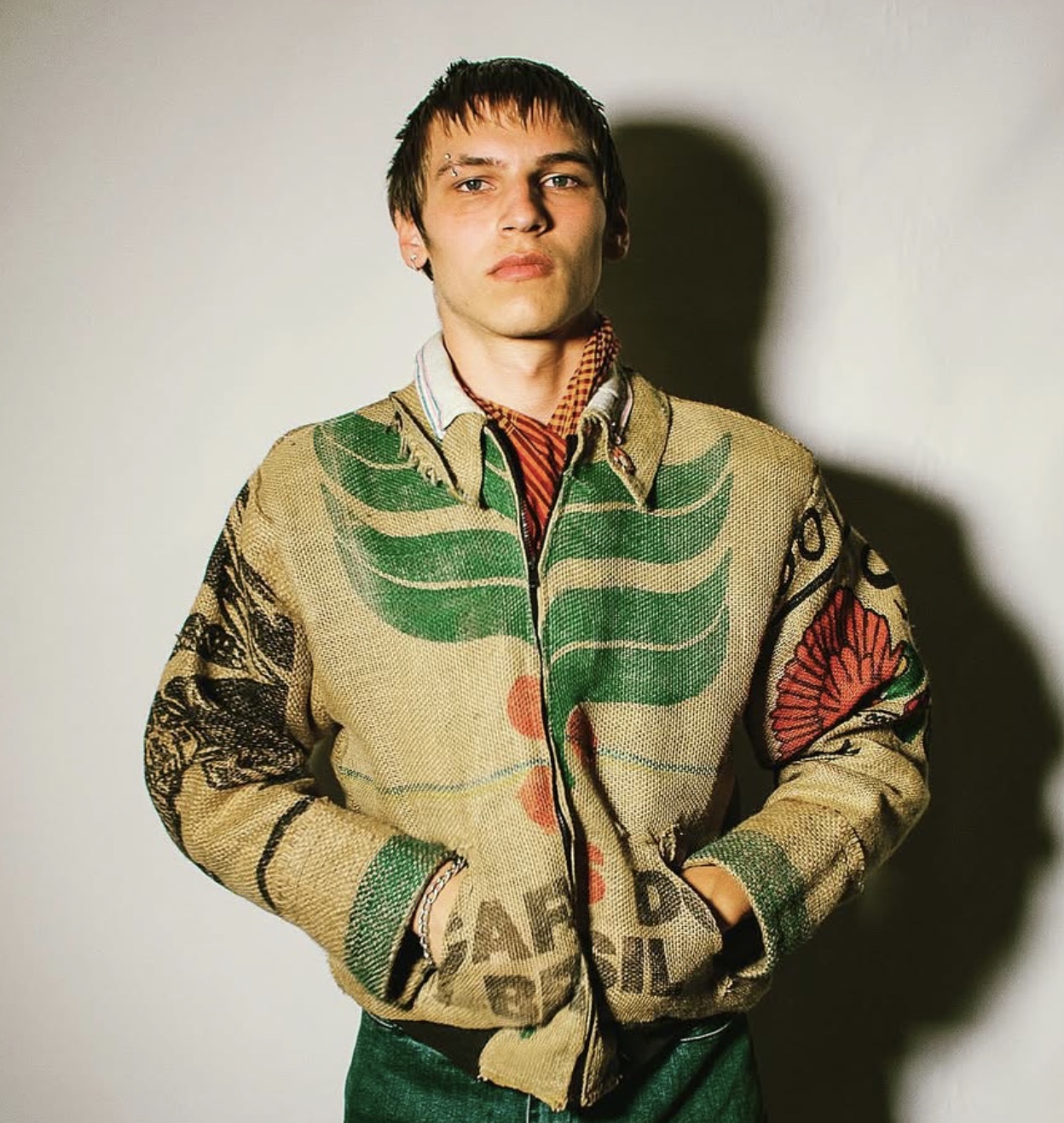 Model in a jacket tailored from repurposed coffee sacks