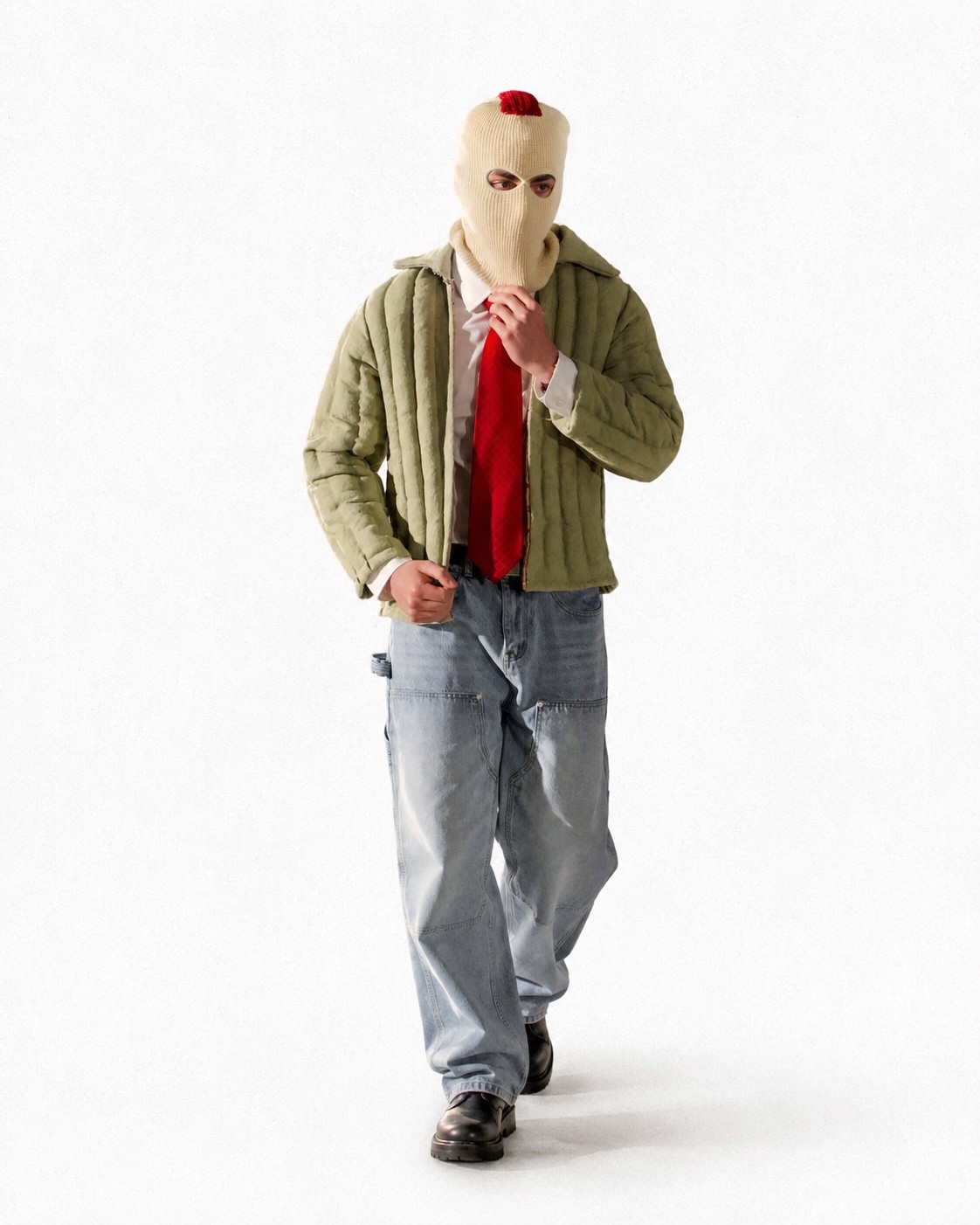 Look 01 — cream balaclava, red tie, olive quilted jacket