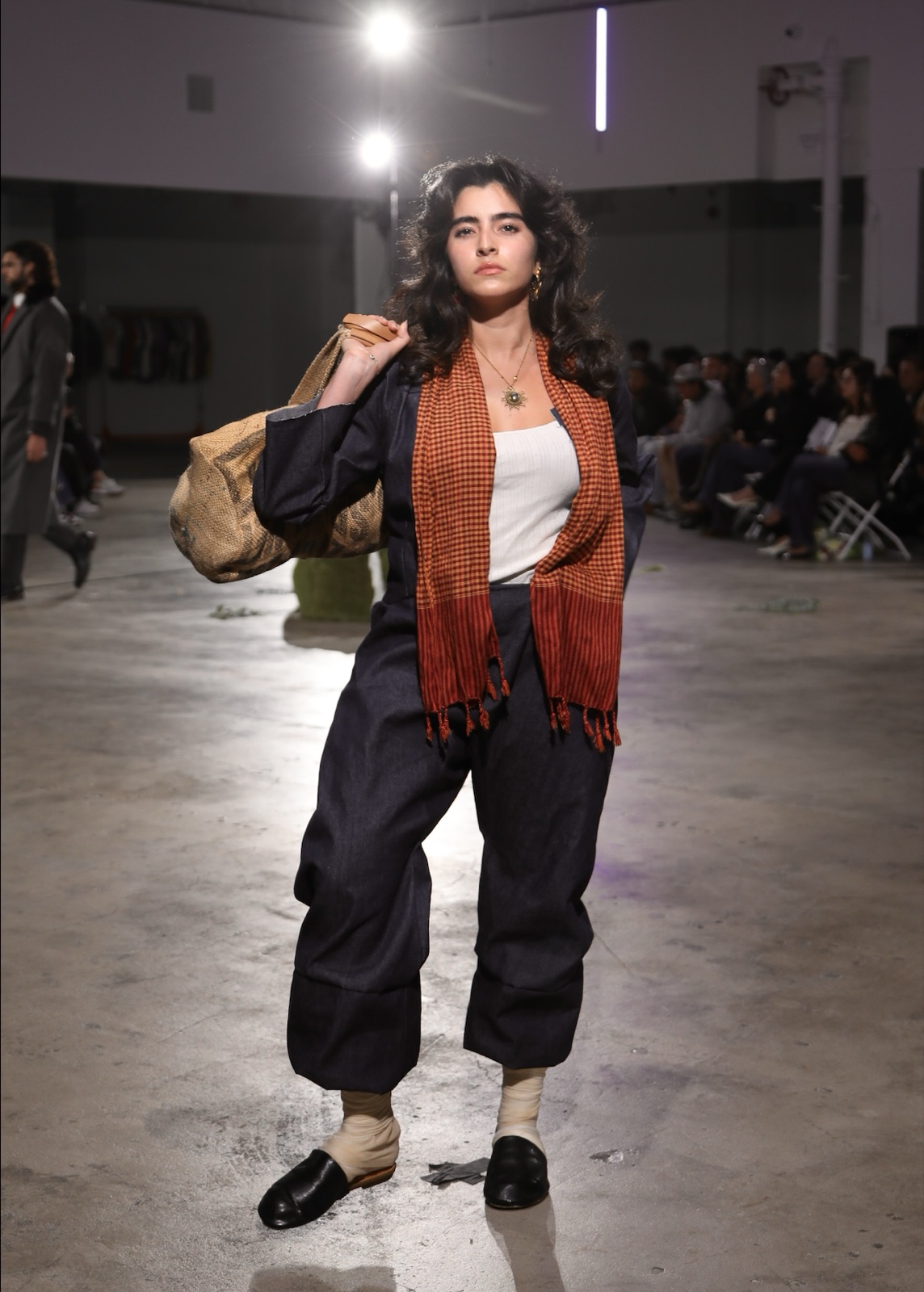 Dark denim workwear suit with checked scarf and burlap duffel